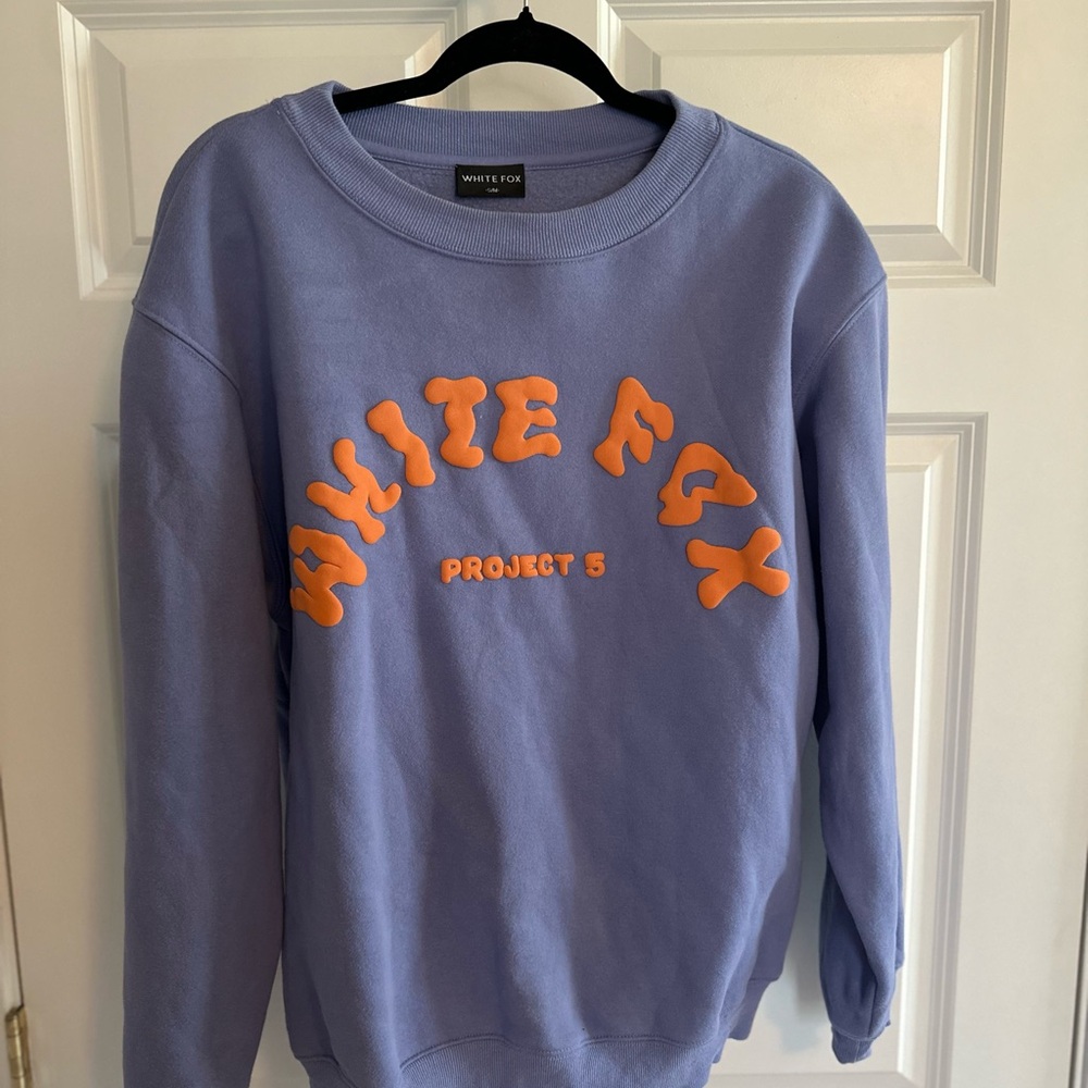 White Fox Purple Sweatshirt with Orange Lettering